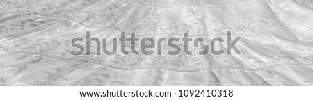 White cotton fabric, with patterns.  tissue, textile, cloth, material, texture
