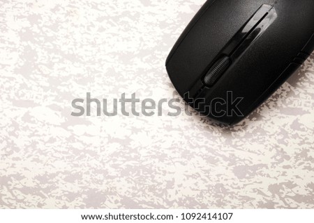 wireless black computer mouse on the desk, Coordination Ideas