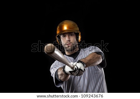 Baseball Player with a bat on a orange uniform.
