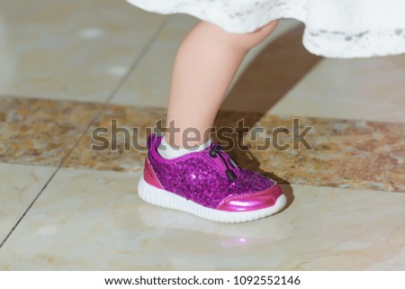 Children's shoes with paillettes. Shoes for girls with sparkles. Purple sequins on things