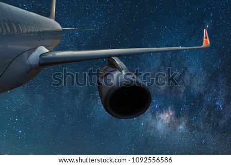 Milky Way with Wing of an airplane. Photo applied to tourism operators.Travel Concept