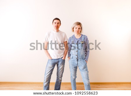 Image of man and woman in new empty apartment