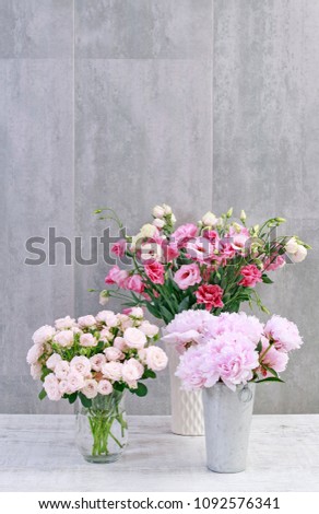 Pink roses, peonies and lisianthus flowers, copy space.