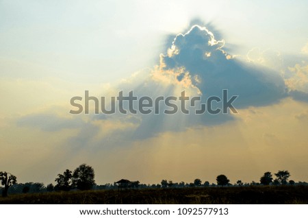 Black silhouette Landscape, Beautiful Sunset with sun Ray of lights through the clouds.