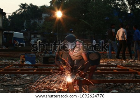 This is a long exposure shot of a labor dedicated on his work. This picture glorifies the effort of a person on gaining the hard earned money