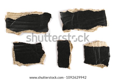 Cardboard scraps with black tape isolated on white background, top view