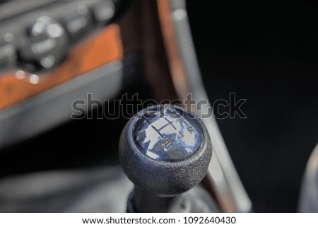 manual transmission gear shift on dark background, close-up
