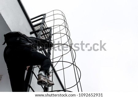 A man climbs the stairs