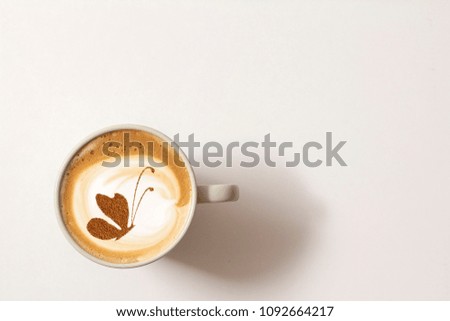 coffee with a picture of a butterfly from cinnamon