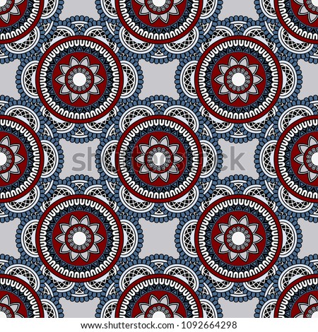 Abstract seamless backdrop. Round colorful texture in blue, red and white colors. Mandala background. Oriental pattern for design