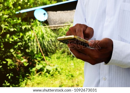 gesture of businessman is using smartphone with touching screen on site