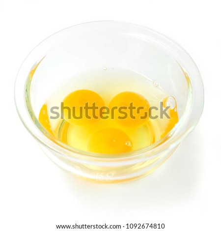 
Eggs are placed in a glass cup together to prepare the fry before making an omelet.