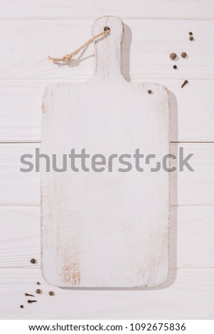 top view of white wooden cutting board Royalty-Free Stock Photo #1092675836