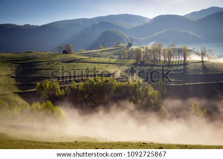 Foggy sunrise in Apuseni, Romania Royalty-Free Stock Photo #1092725867