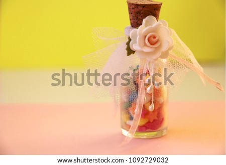 Wedding favor with candies presented in a glass jar.
 Royalty-Free Stock Photo #1092729032