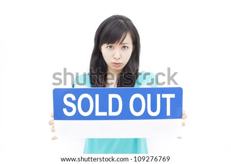 beautiful young woman showing SOLD OUT sign, isolated on white background