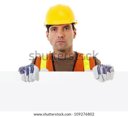 Stock image of construction worker holding blank sign withy copy space