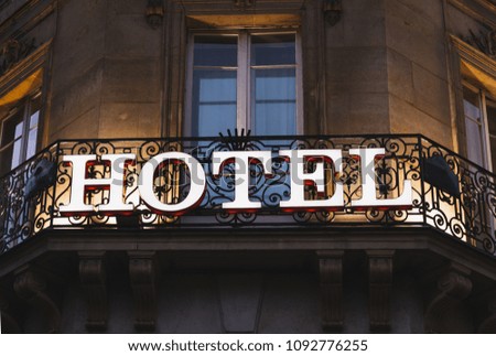 Illuminated hotel sign taken in Paris at night