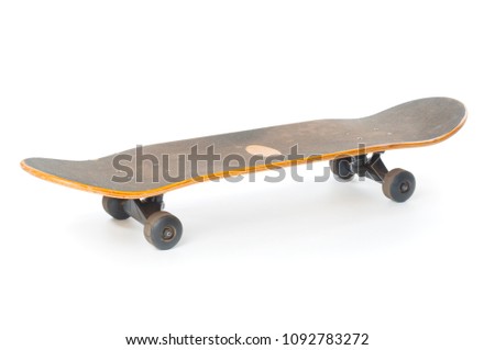 Used skateboard close up isolated on white background