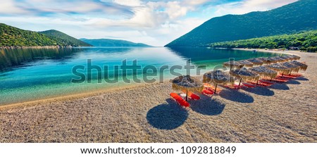 Panoramic morning view of Antisamos Beach. Bright spring seascape of Ionian Sea. Splendid outdoor scene of Kefalonia island, Sami town location, Greece, Europe. Traveling concept background. Royalty-Free Stock Photo #1092818849