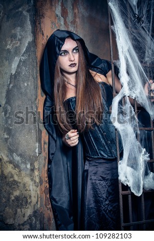 Portrait of a young witch. Halloween, horror.