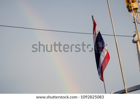 Thailand flag in the blue sky in the morning of the day.