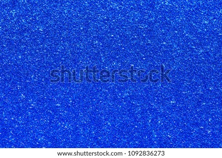 
Blue shiny glitter Christmas texture background.