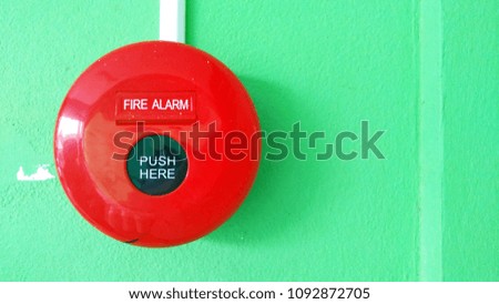 Res circle fire alarm  on the wall. Emergency situation.