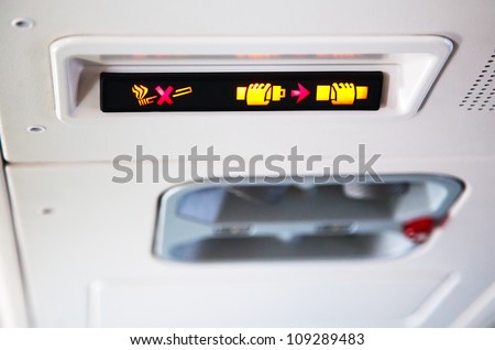 No Smoking and Fasten Seat belt Sign Inside an Airplane
