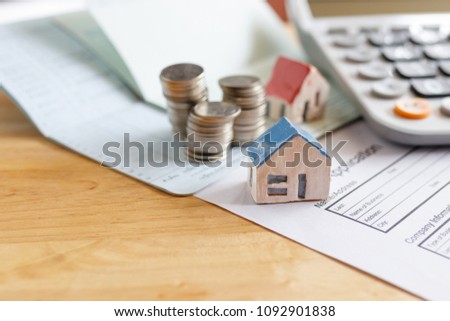 Home insurance form with money,passbook  and calculator.