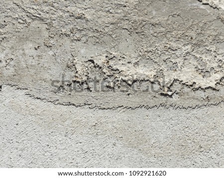 old concrete floor covered with wet cement