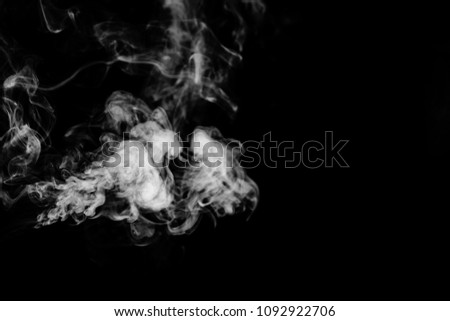 Isolated white smoke effect on black background.
