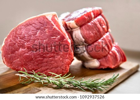 Steak meat. Roasting beef tenderloin. High-quality beef is taken from the hindquarters of the animal typically cut into thick slices that are cooked by boiling or frying. Royalty-Free Stock Photo #1092937526