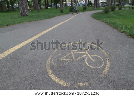  bike path in the park: sign on the asphalt