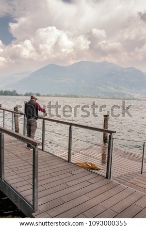 pescatore al lago di Iseo in Lovere, Bergamo, Italy