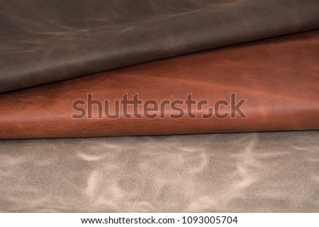 Texture of pieces brown leather. Natural material background.