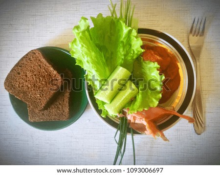Vegetables with bread in a plate for breakfast