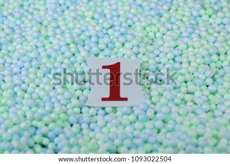 The number 1 of the piece of paper in a pile of small sphere