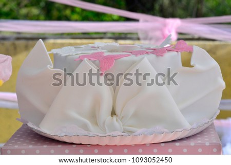 white fondue cake with butterflies