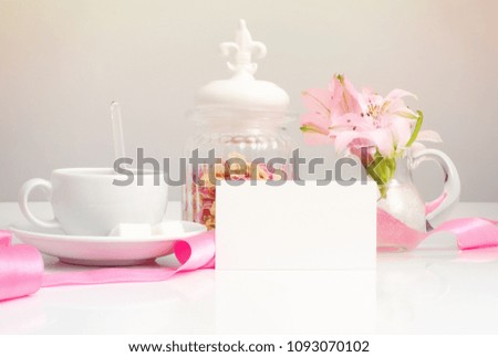 pink tea on table and business card