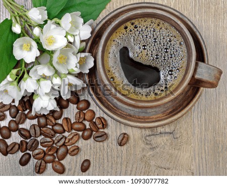 good morning. morning coffee and jasmine flowers on a wooden table. top view.