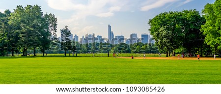 Central Park on a sunny day and a beautiful contrast with skyscrapers and buildings, Manhattan, New York City, USA