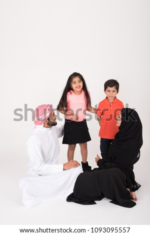 Arab Family sitting on the floor on white background