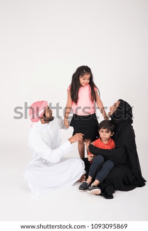 Arab Family siiting on the floor on white background
