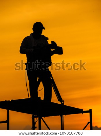 Cameraman with sunset