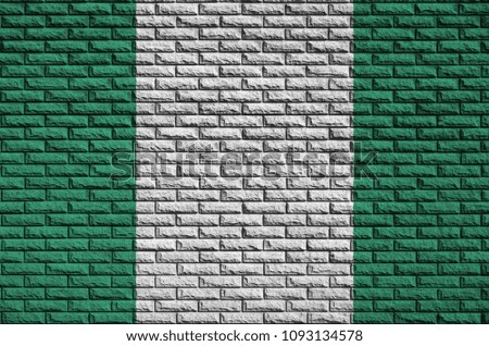 Nigeria flag is painted onto an old brick wall