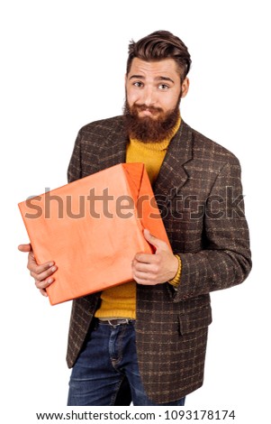 portrait of bearded businessman with gift box. human emotion expression and office, business, finances concept. image isolated white background.