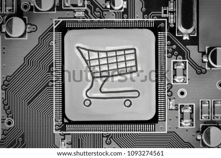 Macro photo of circuit board with shopping cart on the chip surface