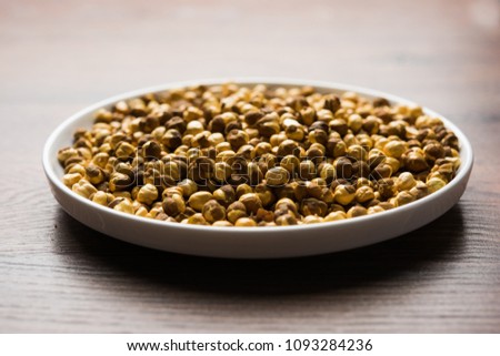 Roasted Chickpea / chana known as futana or Phutana in Hindi served in a bowl or over gunny bag. Selective focus