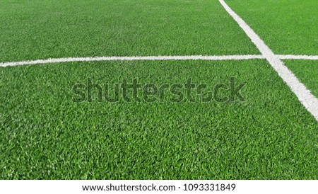 Intersecting lines on green grass field, soccer field